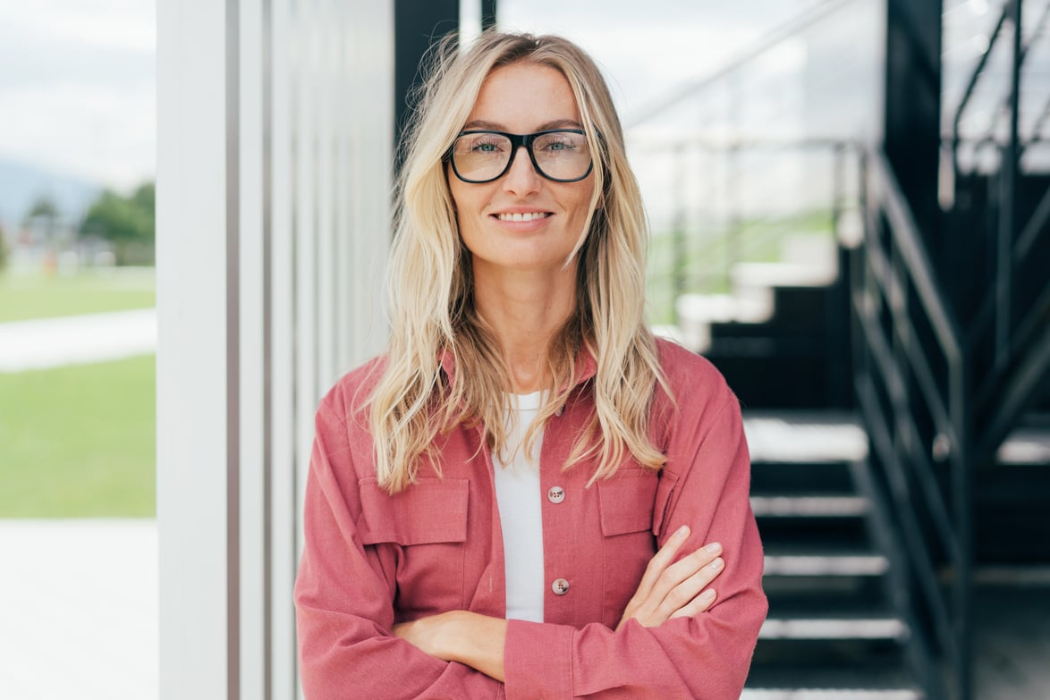 Testimonial Portrait of a Beautiful Businesswoman Standing with Her Arms Crossed.